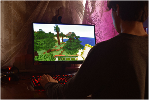 A person using their computer for gaming