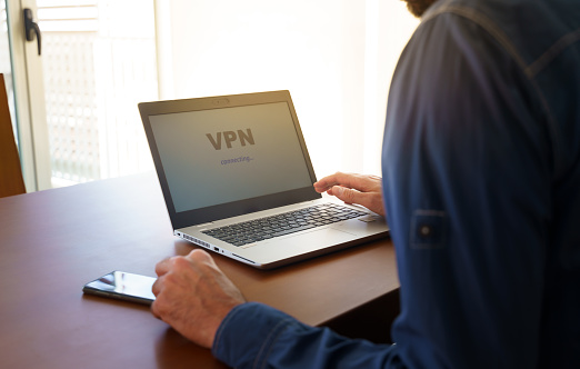 A person using VPN on a laptop